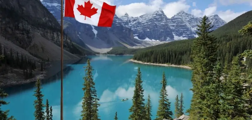 The Canadian National flag set against the Rocky Mountains of Banff National ParkCanada